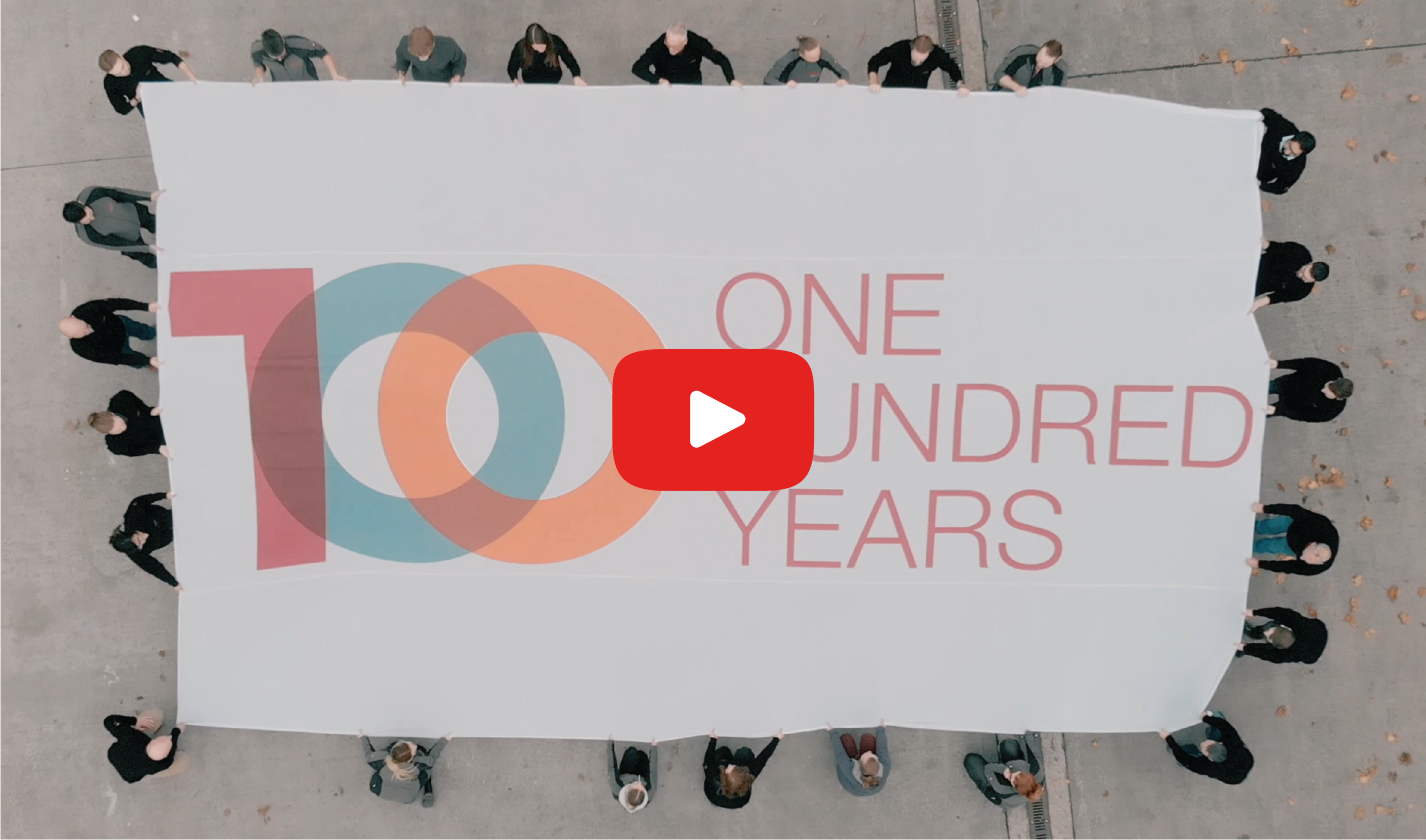100 Year Banner with play button - 640 x 377.png