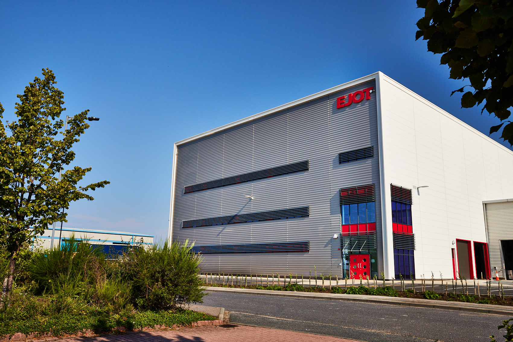 Exterior design is consistent with the EJOT brand and Group buildings around the world, utlising the horizontal structure® façade from DOMICO in EJOT’s corporate colours .jpg